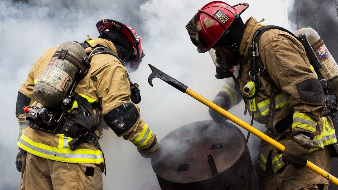 Fire Fighters looking at smoke